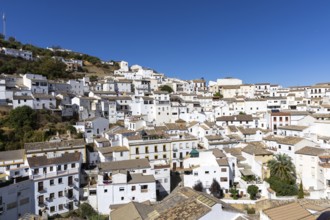 On the road to the white villages. Panorama or skyline of a historic old town with many white