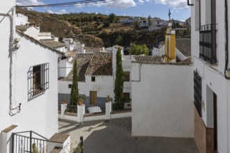 On the road to the white villages. Paths and narrow streets of a historic old town. Ermita de San