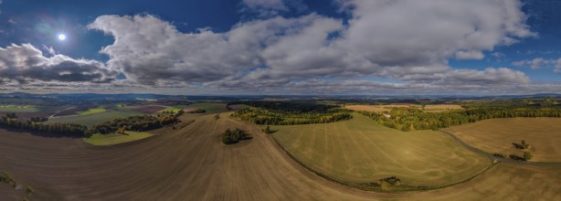 Wide landscape with hills and cloudy sky in the rural region of the Czech Republic. Železná hurka,
