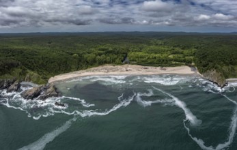 Panoramic view of a beach with crashing waves and dense forests. Aerial view to beautiful Silistar
