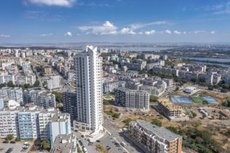 Aerial view of a city with tall buildings and roadways. Aerial view to the skyscraper in the Meden