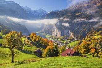 View from the village of the Lauterbrunnen Valley with Staubbach waterfall in autumn with morning