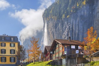 View of town with Staubbach waterfall in autumn, Lauterbrunnen, Bernese Oberland, Canton of Bern,