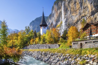 Village church with Staubbach waterfall in autumn, Lauterbrunnen, Bernese Oberland, Canton of Bern,