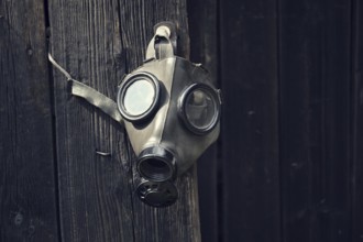 Closeup of a gas mask on a wooden background Prague Czech republic