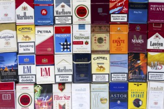 PRAGUE, CZECH REPUBLIC - MARCH 25: Many packs of different cigarettes photographed with top view