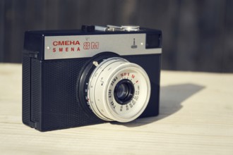 BOROTIN, CZECH REPUBLIC - MARCH 25: Smena 8M old vintage filtered camera on wooden background on