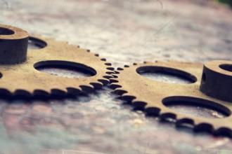 Filtered picture of cogwheels on a colorful wooden background Prague, Czech republic