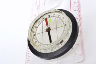 Detail shot of glass compass isolated on white background Prague Czech republic