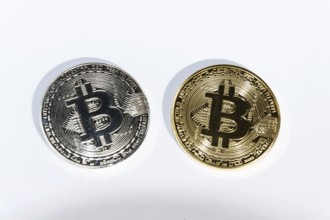Pair of bitcoin coins isolated on white background, cryptocurrency investing Prague Czech republic