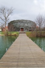 Capi hnizdo Storks Nest riding arena covered with wood resembling a giant birds nest on November