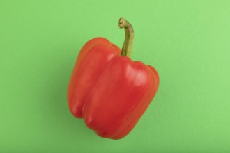 Red pepper on green pastel background. Top view, flat lay, copy space. healthy food, vegetable,