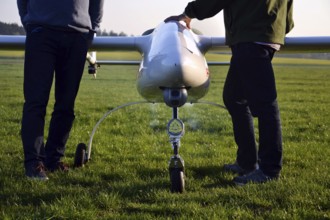 Man preparing unmanned aerial vehicle drone with light and camera Pisek Czech republic