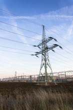 Electricity pylon with dramatic cloudy sky vertical photo Prague Czech republic
