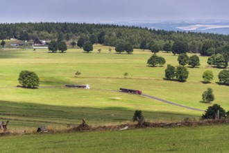 Truck transporting large steel oil and gas pipes, excessive load and heavy delivery concept Prague