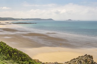 A panoramic view from the Sentier Littoral cliff path shows the vast, shallow bay of Erquy and its