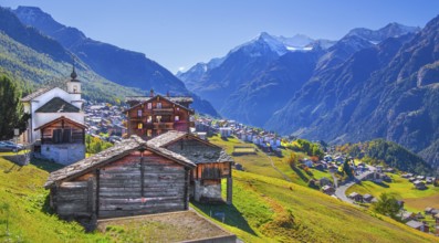 City overview on a mountain terrace above the valley with Ulrichshorn 3925m, Grächen, Mattertal,