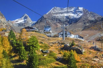 Hohsaas cable car in front of Kreuzboden mountain station with Fletschhorn 3986m in autumn,