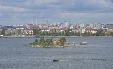 Small island Katajanokanluoto with a wooden house, skyline, harbor, Helsinki, Finland