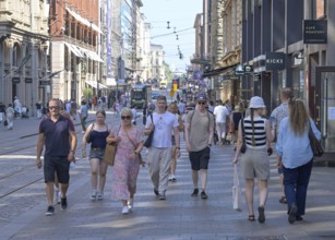Passers-by, Aleksanterinkatu shopping street, Old Town, Helsinki, Finland
