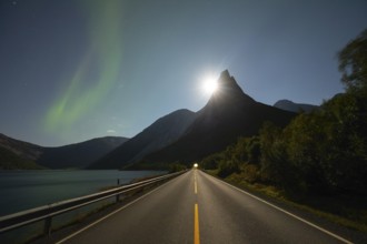 National mountain of Norway - Stetind in the Nordland under auroras and a full moon