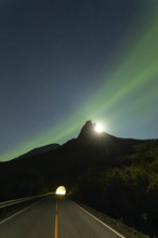 National mountain of Norway, Stetind in the Nordland under auroras and a full moon behind the