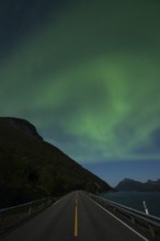 Tysfjord near Stetind Mountain in northern Norway under auroras and full moon