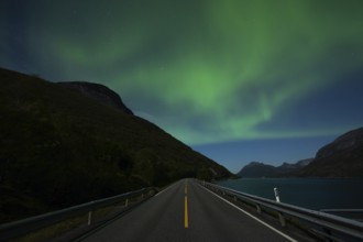 Tysfjord near Stetind Mountain in northern Norway under auroras and full moon