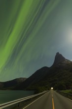 Magical Stetind, mountain in northern Norway under auroras and full moon
