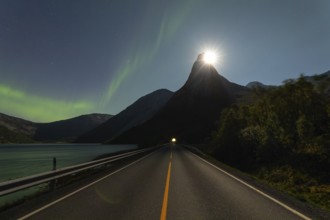 National mountain of Norway, Stetind in the Nordland under auroras and with a full moon shining
