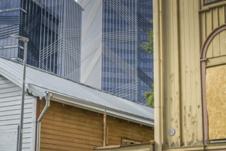 Modern office buildings, high-rise buildings, small old building, wooden house, Maakri-Kvartal