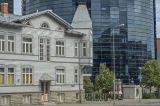 Modern office building, high-rise building, small old building, wooden house, Maakri-Kvartal