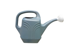 Close-up of a plastic garden watering can on a white background