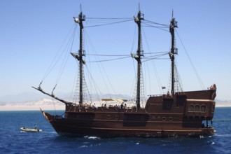 The luxury pirate yacht Black Pearl, with a group of tourists on board, enjoys a cruise through the