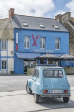 Parked sky blue Citroen 2CV with roll top in front of Café Resto du Port Le Surcouf, a popular