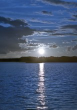 Atmospheric moonrise over Lake Gudelack, Lindow (Mark), Stechlin-Ruppiner Land nature park Park,