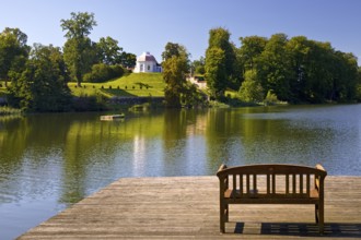 Footbridge with bench to Huwenowsee at Meseberg Castle Park, guest house and conference venue of