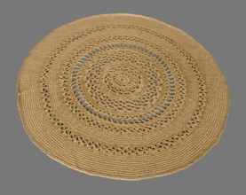Round crocheted rug on a gray background