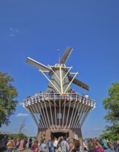 Lisse, Holland, Netherlands, April 25, 2025: the iconic brick windmill at Keukenhof, set against a