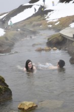 REYKJADALUR, ICELAND MARCH 13, 2017: Swimming in the thermal stream near Reykjavik