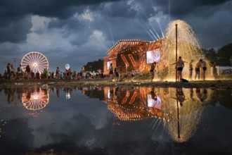 KOSTRZYN NAD ODRA, POLAND - AUGUST 3, 2017: Festival Przystanek Woodstock - fans bath in the mud in