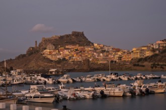 CASTELSARDO, ITALY - AUGUST 20, 2017: Aerial view of boats in port and city Castelsardo, one of the