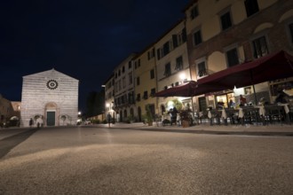 LUCCA, ITALY - JUNE 14, 2015: Old streets with restaurant in the evening in Lucca, Italy. Medieval