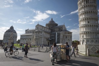 PISA, ITALY - JUNE 15, 2016: Pedestrians near the Pisa Leaning tower, in Square of Miracles (Piazza