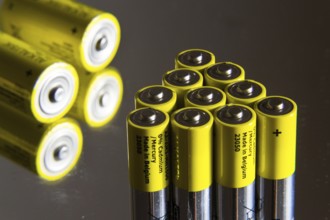 Stack of yellow AA batteries close up, electricity storage concept Prague, Czech republic
