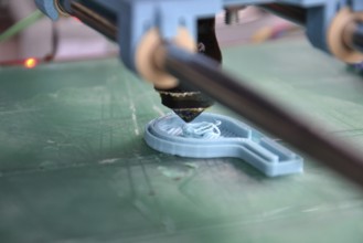 Modular 3d printer prints fully functional blue whistle, green pad