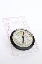 Detail shot of glass compass isolated on white background