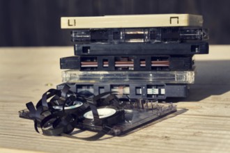 Old broken unwound compact cassette audio tape messed up