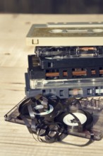 Old broken unwound compact cassette audio tape messed up