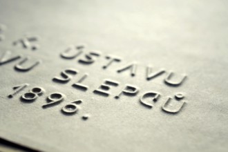 Word blind in Czech language embossed writing letters for blind people used before Braille writing